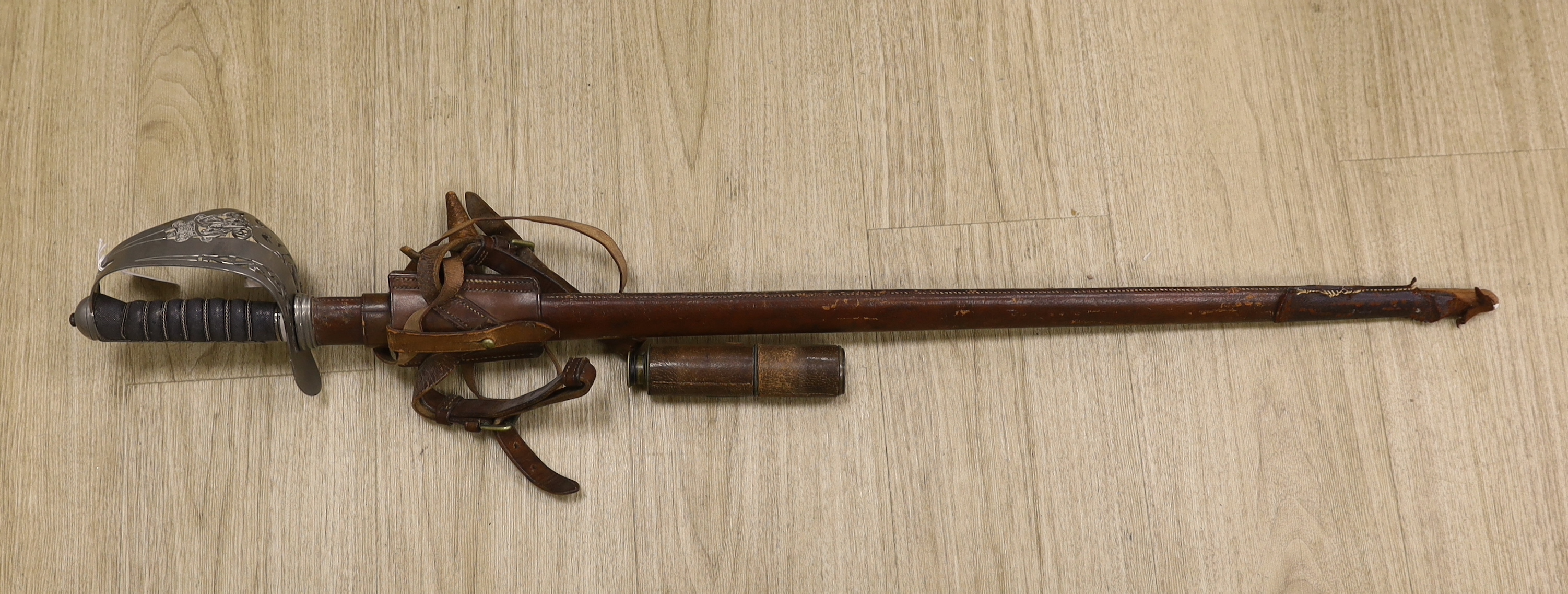 A Victorian officer’s dress sword, Wilkinson blade, together with a telescope, sword, 102cm in length